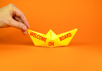 Welcome on board symbol. Concept words Welcome on board on beautiful yellow paper boat. Beautiful...