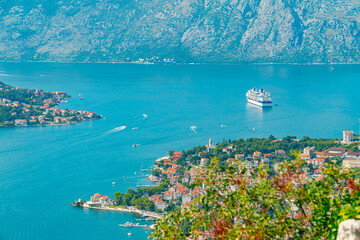 Spectacular View of Kotor Bay: Mountains, Cruise Ship, and Azure Waters