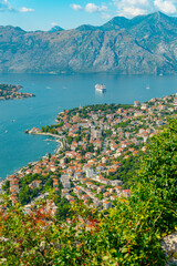 Spectacular View of Kotor Bay: Mountains, Cruise Ship, and Azure Waters