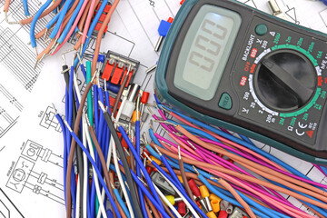 A digital multimeter for measuring the parameters of electrical circuits in an electrical diagram....
