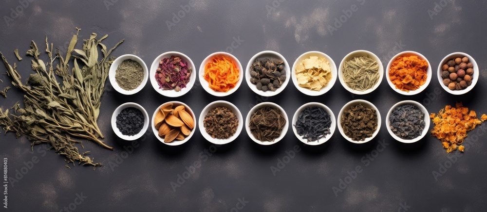 Poster a flat lay arrangement of various types of dried teas placed on a gray table providing ample space f