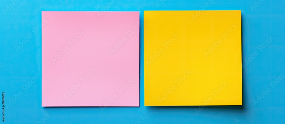 Poster on a blue background there are two yellow and pink square paper stickers creating a frame there is b