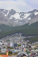 The outskirts of Ushuaia with the mountains behind the town, seen from the harbor