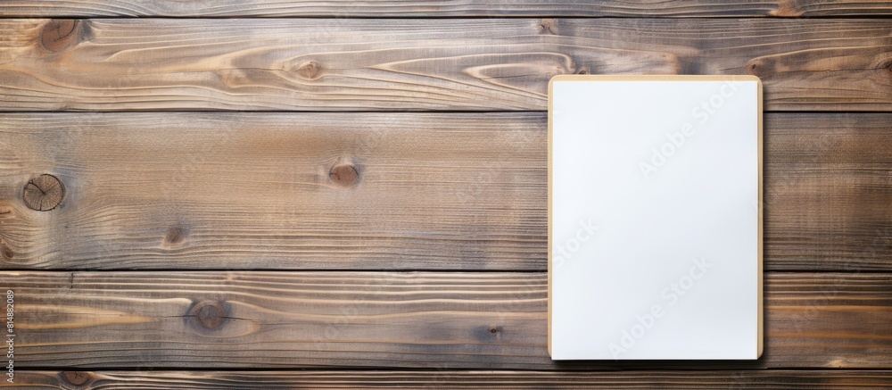 Poster close up of a vintage wooden table with an old fashioned notebook a smartphone and a copy space imag
