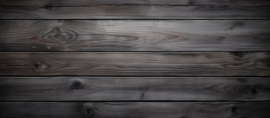 Obraz premium A wallpaper featuring a textured dark gray wooden surface that provides a copy space image