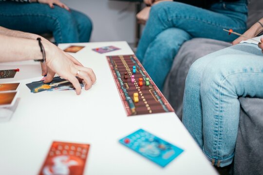 05.11.2024 Krakow, Poland. Group of friends playing a dixit game at home