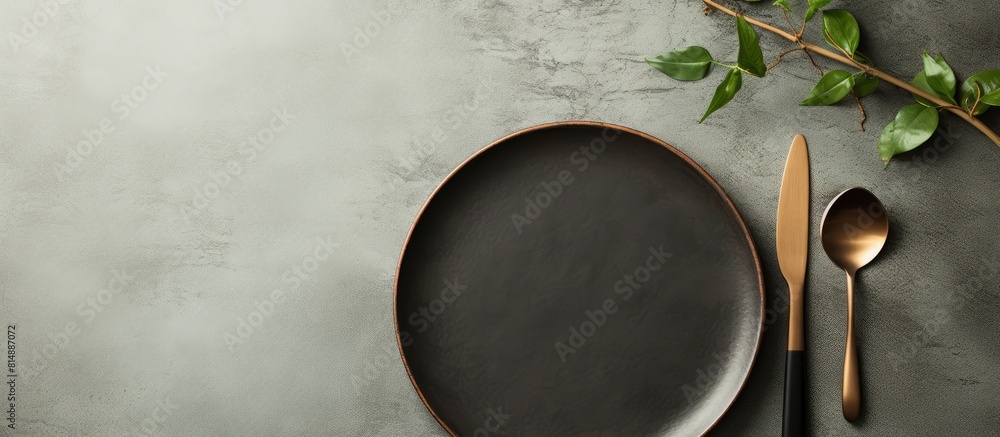 Poster preparing dinner with a variety of dishes and cutlery on a concrete texture background showcasing a 