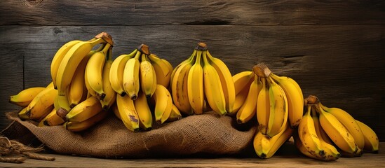 A copy space image showcasing ripe bananas placed on a rustic wooden surface - Powered by Adobe