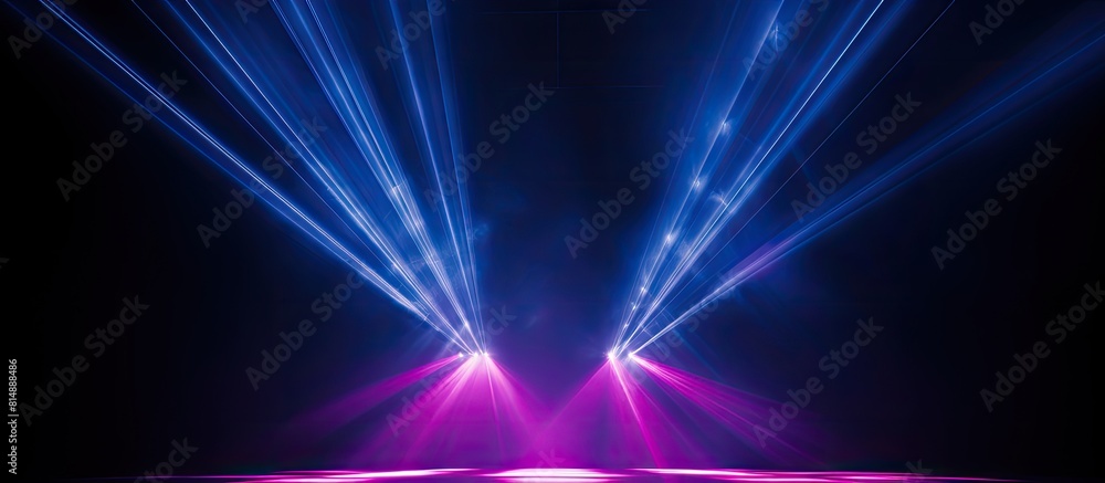 Poster stage spotlights cast pink beams of light against a dark blue backdrop creating a captivating stage 