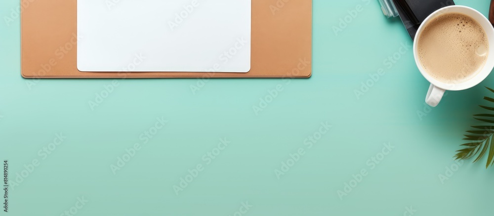 Poster top view of a contemporary workspace featuring a laptop a coffee cup a tablet and a blank sheet of p