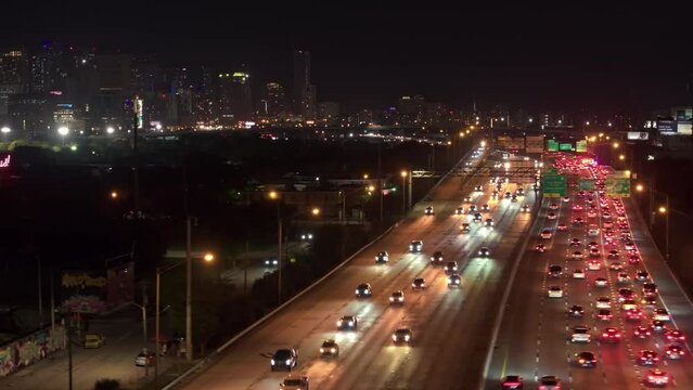 Aerial drone panoramic view of Miami i95 city traffic at night. Cars driving at night in Downtown Miami I 95 Highway 