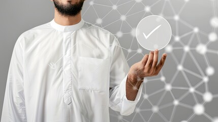 a Saudi man in a white shirt reaches out to touch a virtual screen displaying a check mark icon, set against a sleek light grey backdrop.