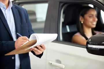 Man, paperwork and standing by car at dealership with happy woman, document for inspection or...