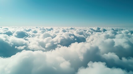 Aerial view White clouds in blue sky, high above the Earth's surface, creating a picturesque scene