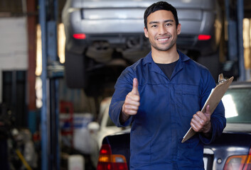 Man, mechanic and thumbs up in workshop portrait, repair garage and automotive engineering for car...