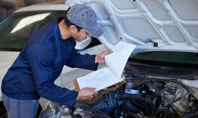 Mechanic, working and clipboard with car hood, checking and automotive engineering service with man or repairman. Inspection, break fluid and transmission or check engine, workshop and professional