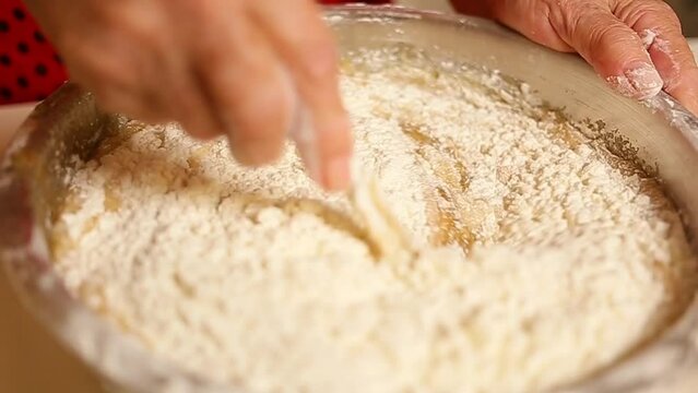 An elderly woman preparing dough Process cooking food concept	