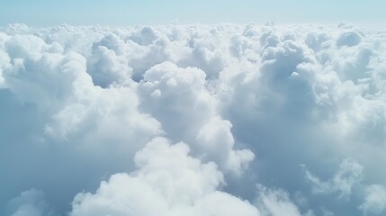 Aerial view White clouds in blue sky, high above the Earth's surface, creating a picturesque scene