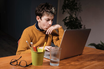 Teen Studying at Home - Concentrated and Productive