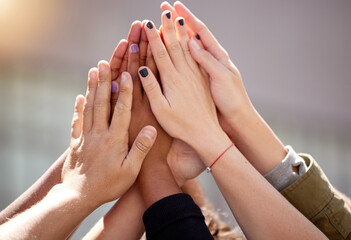 People, hands and group high five for community solidarity or justice support for gender equality,...