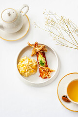 Light breakfast in a restaurant with green tea and pumpkin puree