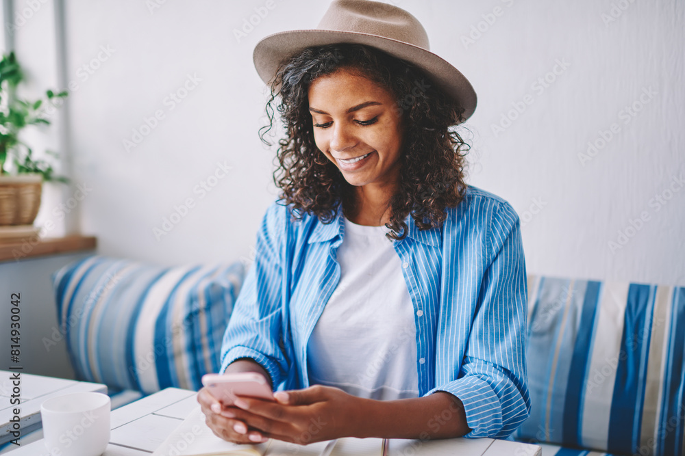 Poster smiling african female bogger installing application for creating new publication on content website