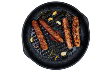 Grilled sausages on grill frying pan top view isolated on white
