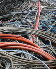Old electrical wires in landfill for recycling copper and plastic
