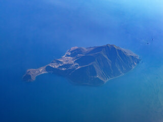 Filicudi island aerial view from airplane at sunset, Aeolian Islands, Sicily, Italy