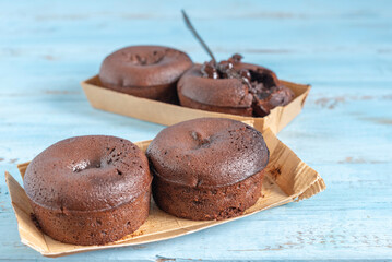 Double Chocolate Muffins on wooden background.