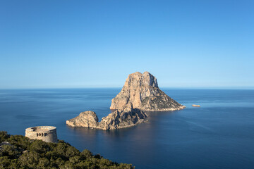 Ibiza - Wiew on the Es Vedrà island and on the Torre des Savinar Tower