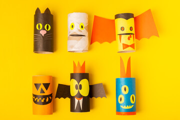 Toilet paper crafts on a colored background. Kids crafts made with toilet paper roll. DIY. Handmade. Paper toys. Origami animals. Concept of children's educational games. Place for text. Copy space.