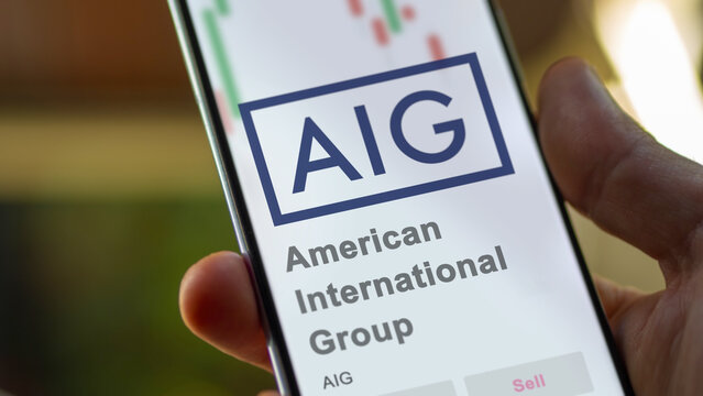 April 09th 2024 , New York City, New York. Close up on logo of American International Group on the screen of an exchange. American International Group price stocks, $AIG on a device.