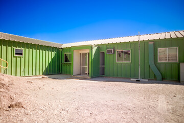 Green container modules combined to form offices at a mine