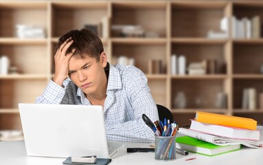 Obraz premium Sad young student have anxiety of exams, prepare for test