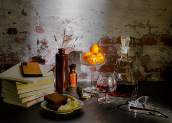 Still life with wine, bread, cheese and antique pocket watch