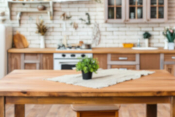 Blurred kitchen background, mockup, display for product advetising. interior of light kitchen with white counters, dining table and big window, blurred view. Simple and fashionable dining kitchen