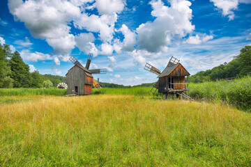 Amazing summer view of traditional romanian windmill.