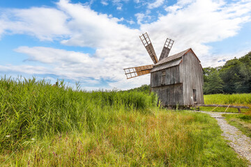 Amazing summer view of traditional romanian windmill.