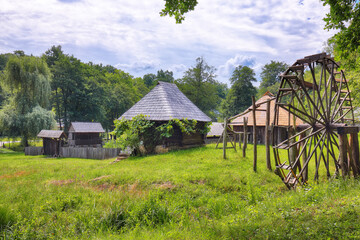 Amazing summer view of traditional romanian windmill.