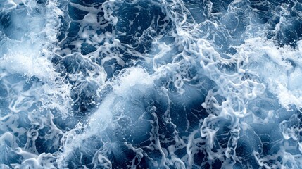  A large body of water, covered in foamy blue waves, adjacent to a boat