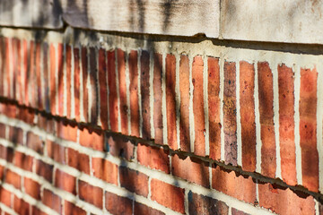 Aged Brick Wall Detail with Peeling Paint in Natural Light