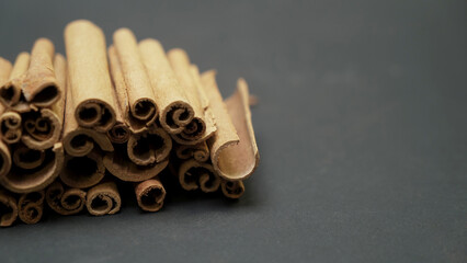 Cinnamon sticks on a dark table