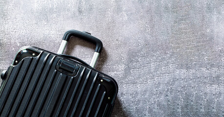 Top view of luggage and text space,Top view of a suitcase [on a white background,Black luggage set on dark background, top view image, flat lay composition. Travel minimalist concept, 