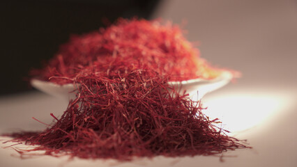A pile of saffron threads in the white bowl