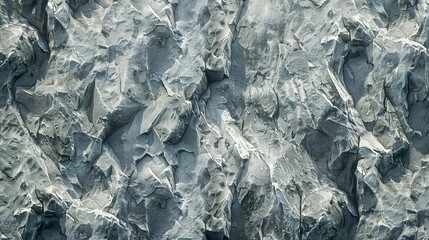 Obraz premium Basalt rocks at Reynisfjara Black Beach ,cobblestone road pavement texture, grass between stones ,abstract background of white pebble stones