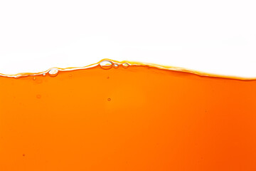 Orange juice texture, close-up, macro, isolated white background,Close up bright orange juice...