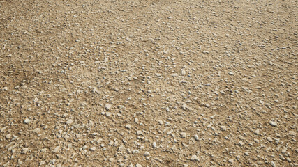 Concept or conceptual brown background  of rough and grunge ground gravel texture floor as a modern pattern layout. A 3d illustration metaphor for construction, architecture and landscape design