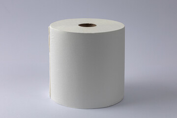 Toilet paper roll on grey white background.