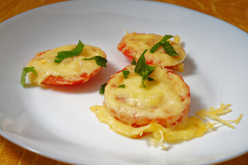 Tomato with cheese appetizer on plate